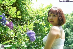 A woman in a blue bra and panties posing for a picture.