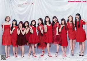 A group of girls dressed in costumes posing for a magazine.